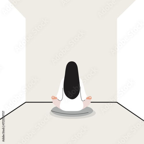 Woman meditates in lotus position within minimalist room facing away