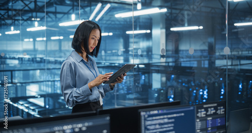 Wallpaper Mural Asian Female Data Analyst Studies Online Logs on Her Tablet Computer, Standing in a Modern Data Center with Server Systems. Young Woman Searching for Patterns to Improve Online Data Flow Torontodigital.ca