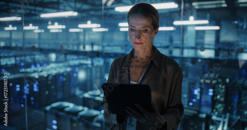 Fotografie Portrait of a Female Systems Administrator Standing in a Glass Office, Adjusting