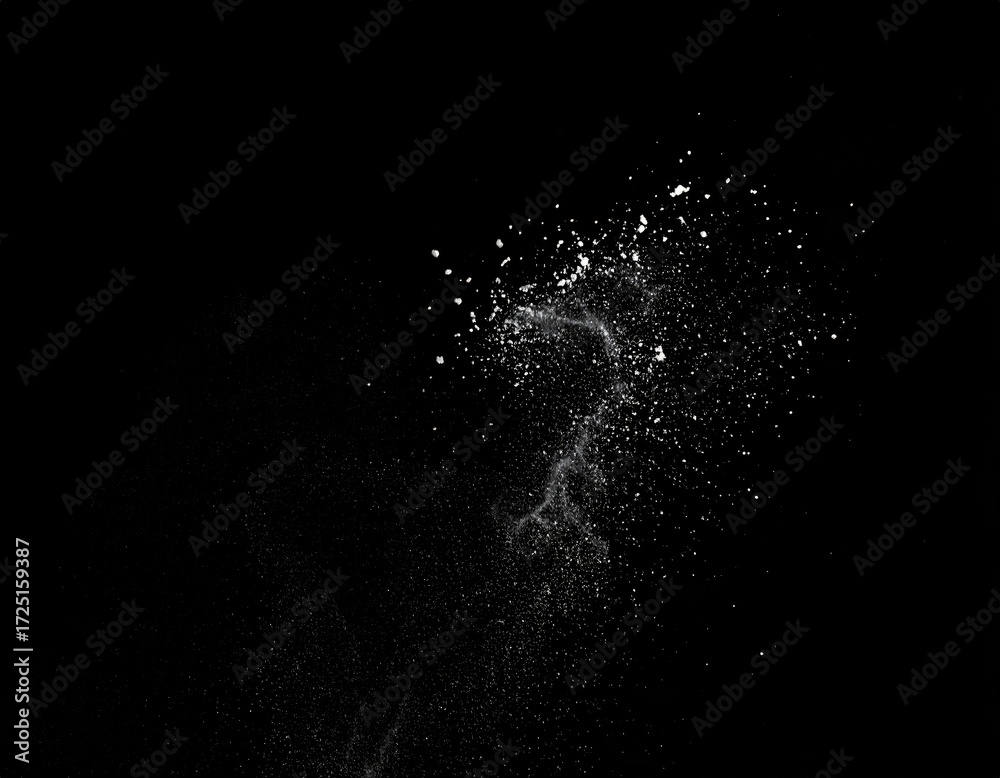 Obraz premium Abstract, white particles suspended in mid-air against a black background
