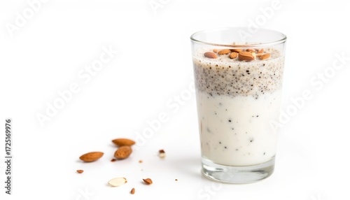Almond milk smoothie with chia seeds and nuts in glass  