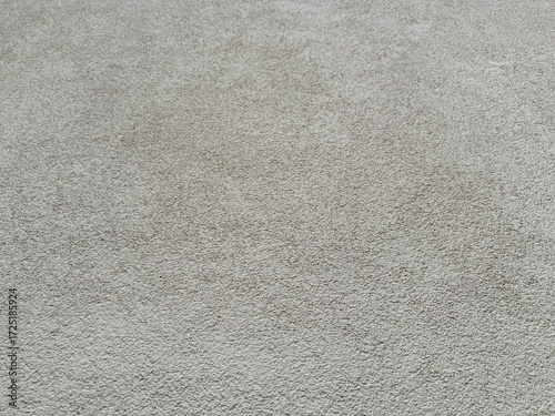 Light gray old plaster wall with rough texture. Grungy, neutral architectural background image for design, copy space, construction, vintage, rustic theme wallpaper 