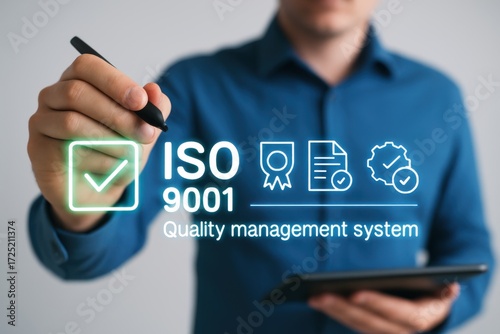 Person using stylus to draw iso 9001 quality management system icons on digital interface