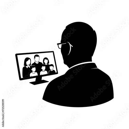 Elderly man viewing family photo on computer screen from behind  