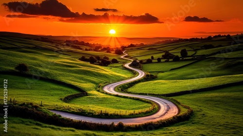 Sunset Road Through Rolling Green Hills