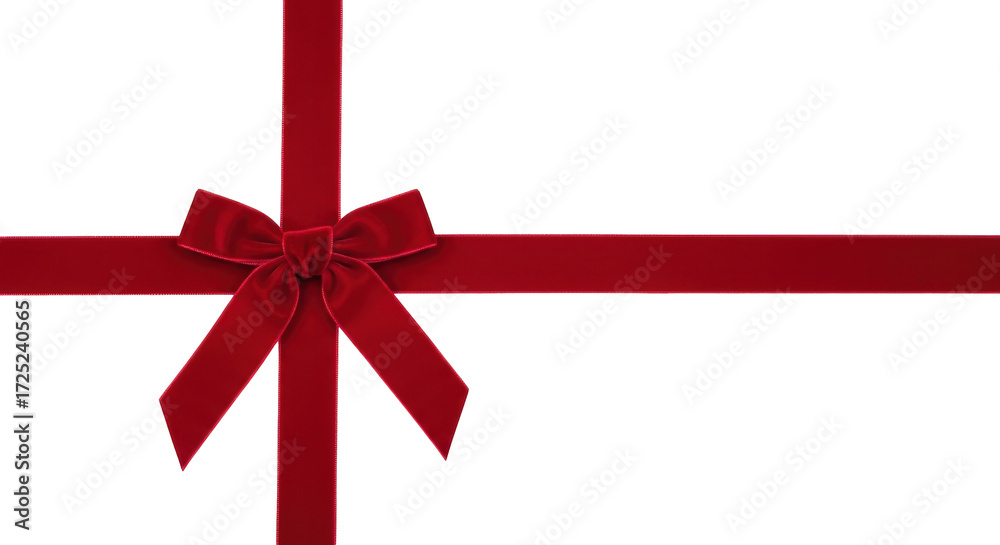 Naklejka premium Isolated red velvet ribbon tied into a bow, festive decor for a gift or holiday project