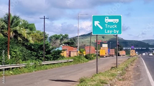 A highway sign points to a 