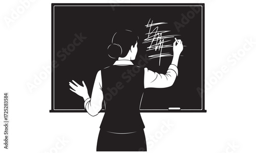 Silhouette of an Educator Teaching and Writing on a Blackboard