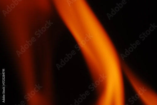 Tableau sur toile Tongues of flame on a dark background