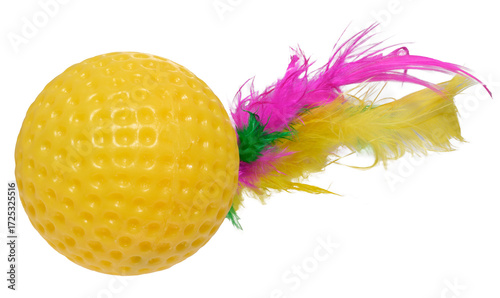 A bright yellow rubber ball toy with a golf ball texture and colorful feathers.