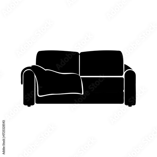 Modern black sofa with a throw blanket casting a comfortable shadow