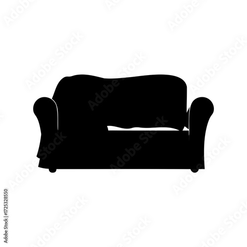 Silhouette of a vintage sofa with a blanket creating a cozy scene