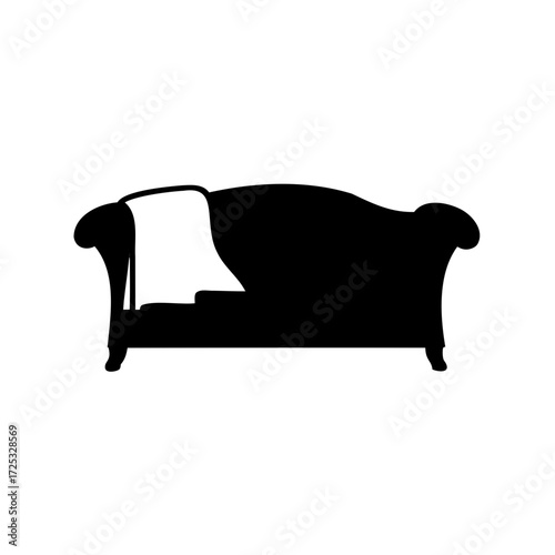 Elegant silhouette of a vintage sofa with a draped blanket design