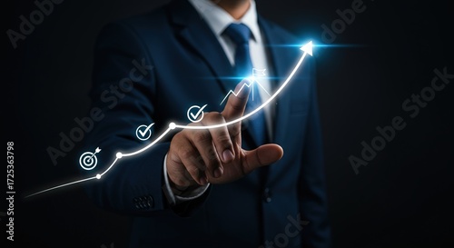 Businessman pointing at a rising arrow graph showing progress and success in business growth and strategic planning