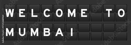 Black color analog flip board with word welcome to mumbai on gray background