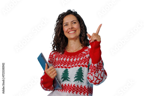 Woman in holiday sweater holding a laptop, smiling and pointing up, indicating an idea or inspiration