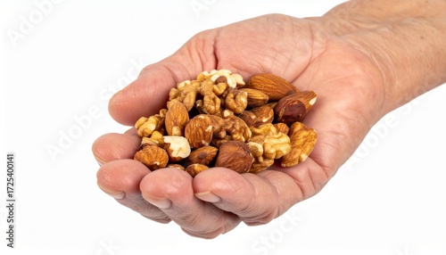 A handful of assorted nuts in a hand, showcasing the variety and natural goodness. The image captures the textures and colors of walnuts, almonds, and other nuts