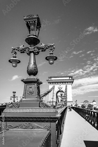 old street lamp on chain bridge over danube in budapest, hungary