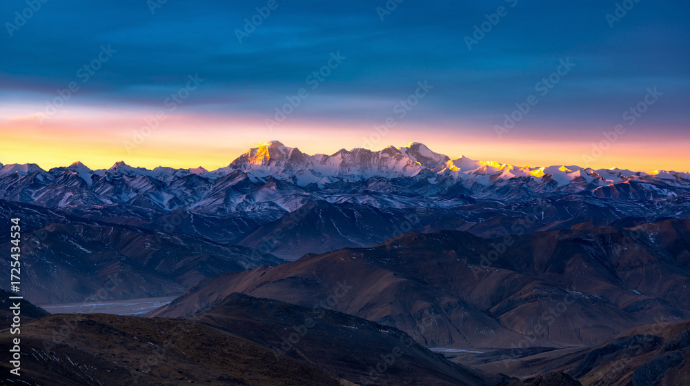 Naklejka premium Sunrise over the snow-capped mountains from a viewing platform on the way to Mount Everest in Tibet