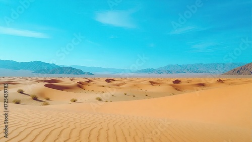 Desert Dunescape with Distant Mountains and Sparse Vegetation Un