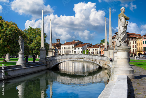 View of canal with statues on square Prato della Valle in Padova (Padua), Veneto, Italy. Architecture and landmarks of Padua.