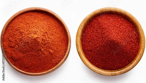 red paprika powder in wooden bowl top view isolated on white or