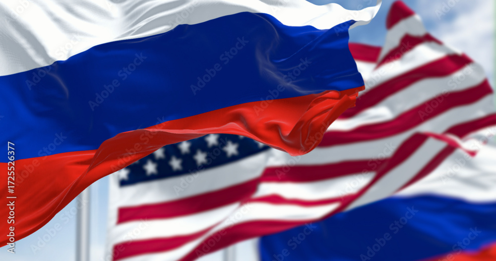 Obraz premium Russian and American flags waving side by side in wind. 3D render