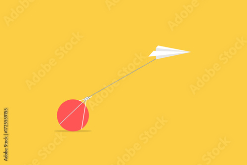 Paper plane pulling a big stone or rock, business concept of hardship and burden