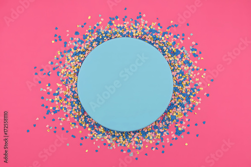 Round blue frame on pink background with colorful confetti border