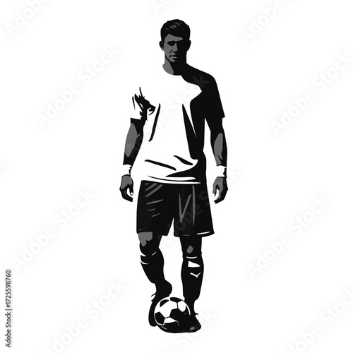 Silhouette of soccer player standing with ball ready for action on a field