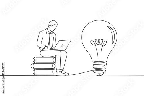 Person on books with laptop next to a lightbulb