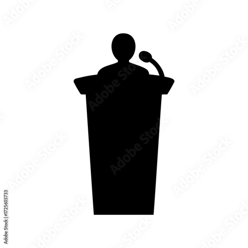 Silhouette of a person giving a speech at a podium with microphone