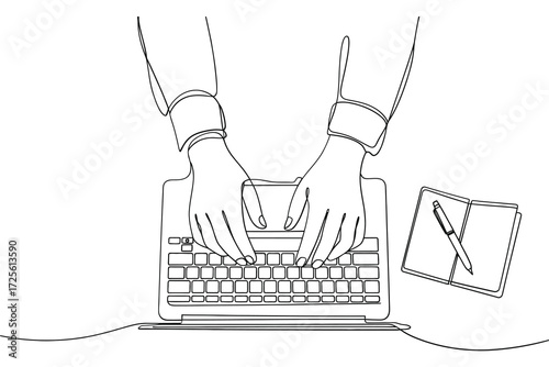 Hands typing on a keyboard with a pen and paper nearby