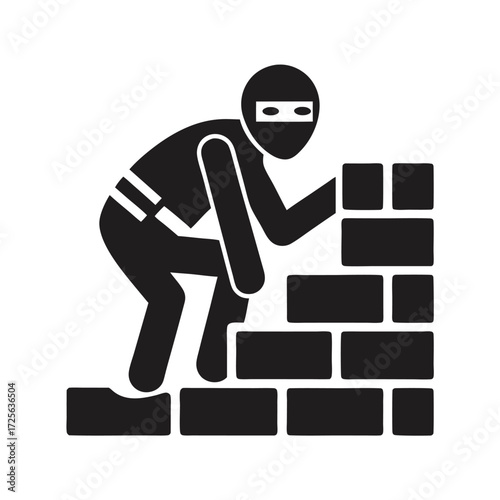 Masked monochrome burglar stealthily climbs over stacked bricks during a daring night time exploit