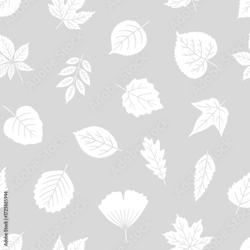 Seamless pattern with white silhouette leaves on gray background. Leaf of maple, linden, birch, chestnut, and others. Print for textile, package, and wrapping paper. Vector illustration