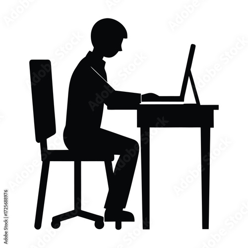 Silhouette of a person working diligently at a desk