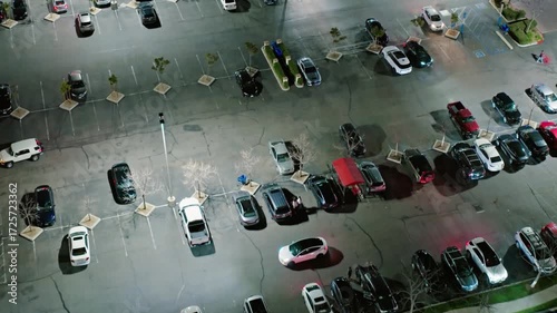 Wallpaper Mural Aerial view captures a parking lot filled with cars at night under streetlights Torontodigital.ca