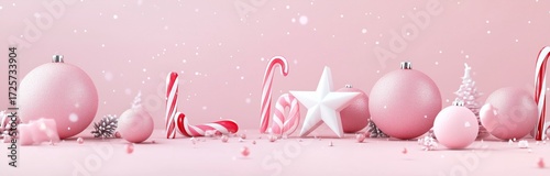 Festive Pink Holiday Scene With Ornaments and Candy Canes on Display.