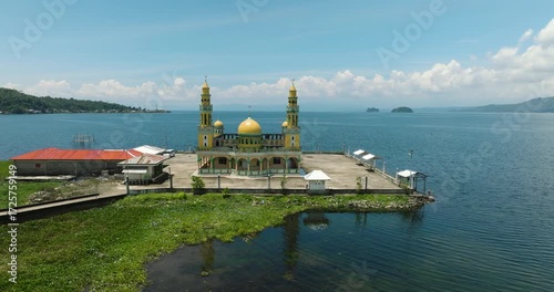 Linuk Masjid a mosque beside the Lake Lanao in Lanao del Sur. Blue sky and clouds. Mindanao, Philippines.