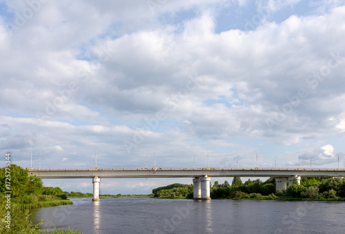 An old concrete bridge over a river, on the outskirts of the city
