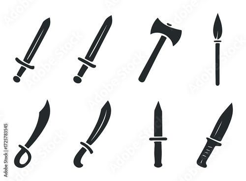 Silhouette of blades and axe on dark background