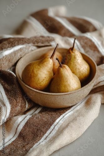 Aesthetic photo with fresh pears on textile. Minimal rustic still life with natural fruit.