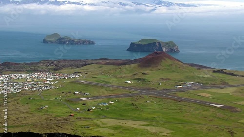 Aerial view of heimaey island with airport and town, iceland