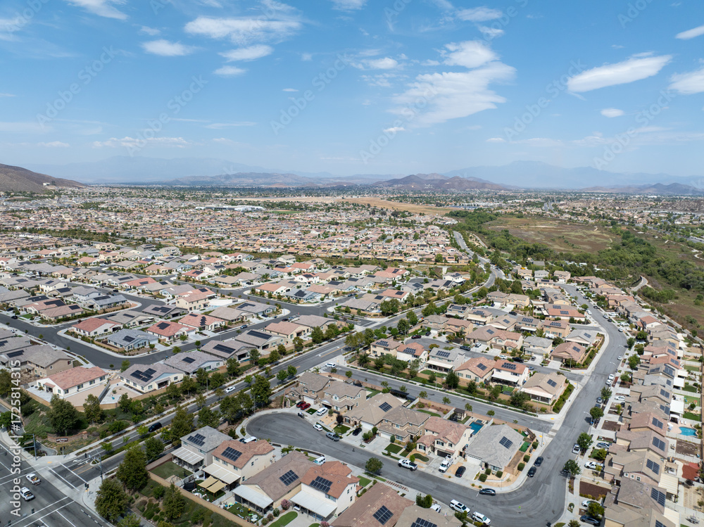 Fototapeta premium Aerial view of a sprawling neighborhood of family homes in Menifee city in Riverside County, California, United States