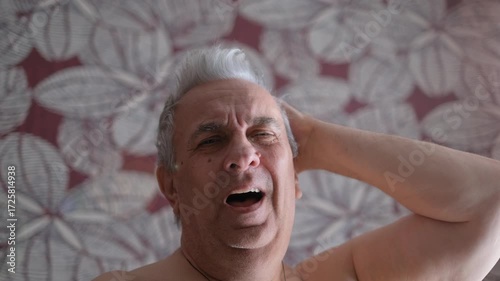 A sleepy, lazy, yawning, fat elderly man