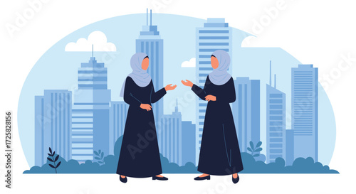 Two women in hijab talking in front of skyscrapers.