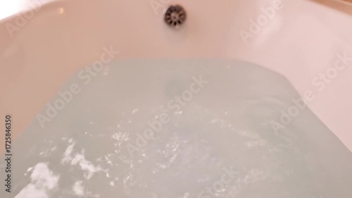 Adding bath salts to a relaxing bath