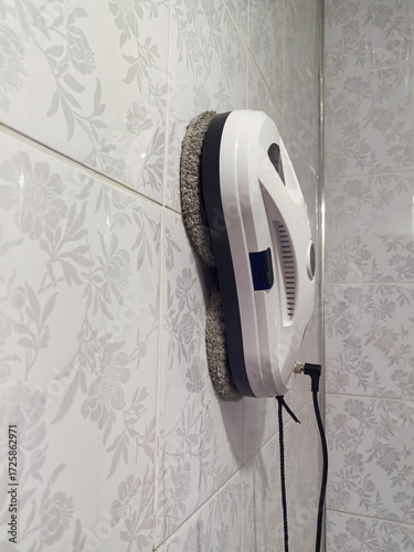 a robot cleaner of windows and walls, modern equipment for cleaning the house.