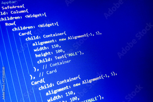 Close-up view of computer code on a blue background, featuring widget definitions and alignment properties. Ideal for technology and programming themes.