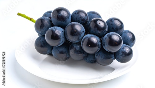 Dark grapes on a small plate